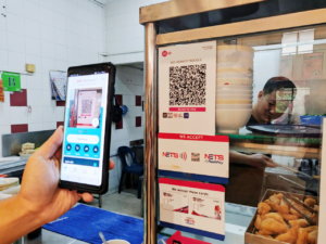 NETS QR codes like this one at the Big Harvest Ban Mian stall in Canteen 14 are available at most establishments in NTU. Mobile payments have become a common way to pay for food in the university. (PHOTO: Osmond Chia)